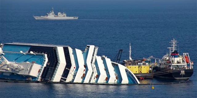 Feb. 13: Ongoing operations to remove fuel from the half sunken hulk of the luxury ship Costa Concordia a month after it ran aground are seen outside the port of Isola del Giglio island in Tuscany, Italy.