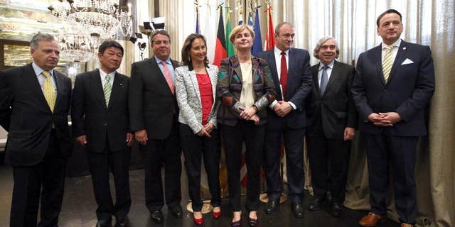 From left, EU Joint Research Centre's director general Dominique Ristori, Japan's Economy, Trade and Industry Minister Toshimitsu Motegi, Germany's Economy and Energy Minister and deputy chancellor Sigmar Gabriel, France's Ecology and Energy Minister Segolene Royal, Italy's Economic Development Minister Federica Guidi, Britain's Secretary of State for Energy and Climate Change Edward Davey, U.S. Secretary for Energy Ernest Moniz and Canada's Natural Resources Minister Greg Rickford pose for a photo on the occasion of the G7 meeting for Energy in Rome, Tuesday, May 6, 2014. (AP Photo/Riccardo De Luca)