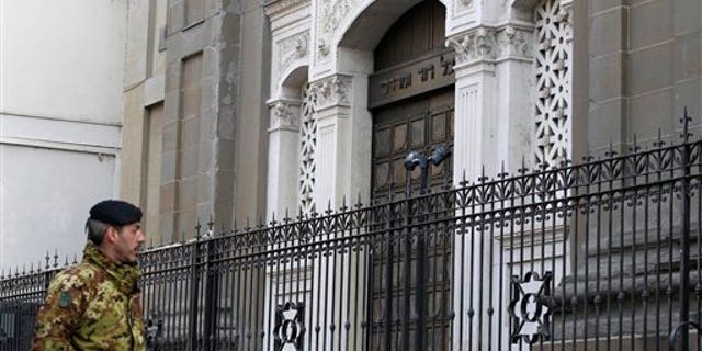 March 15, 2012: An Italian army soldier patrols outside a Milan synagogue.