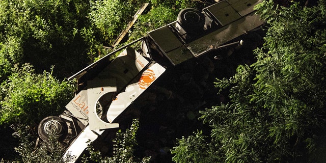 June 29, 2013: A bus lies on its side after plunging off a highway near Avellino, southern Italy.