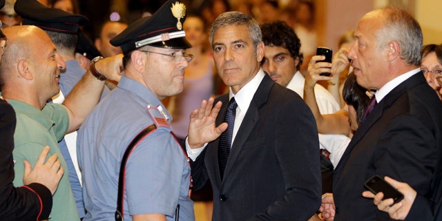 July 16: U.S. actor George Clooney leaves a tribunal in Milan, Italy. Clooney appeared in court as a witness in a fraud trial against defendants charged with co opting his name for a line of clothing. (AP)