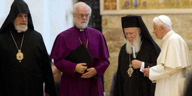 Oct. 27, 2011: From left, First Primate of the New Armenian Diocese of France Norvan Zakarian, Archbishop of Canterbury Rowan Douglas Williams, Ecumenical Patriarch Bartholomew I, and Pope Benedict XVI leave at the end of a peace meeting in the St. Mary of the Angels Basilica, in Santa Maria degli Angeli, central Italy.