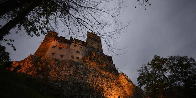 Bran Castle lies on top of cliffs in Bran, Romania.