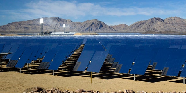 In this Feb. 13, 2014 file photo, mirrors are shown during a tour of the Ivanpah Solar Electric Generating System in the Mojave Desert near the California-Nevada border.