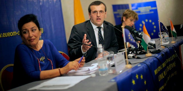 Nov. 2: European Union Chief Elections Observer Cristian Preda, center, from Romania, addresses a news conference in Abidjan, Ivory Coast.
