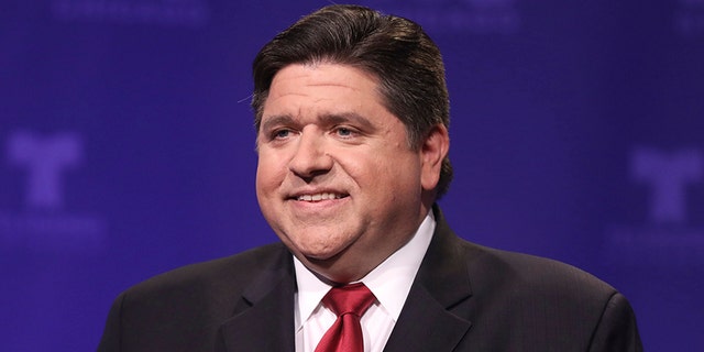 Democratic candidate for Illinois governor J.B. Pritzker takes his podium position before a televised forum Tuesday, Jan. 23, 2018, in Chicago. Six Democrats are vying for the chance to unseat Republican Gov. Bruce Rauner on March 20. (John J. Kim/Chicago Tribune via AP, Pool)