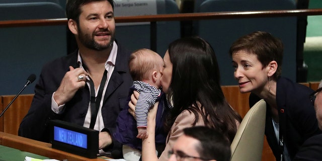 New Zealand Prime Minister Jacinda Ardern kisses her baby Neve before speaking at the Nelson Mandela Peace Summit during the 73rd United Nations General Assembly in New York, U.S.