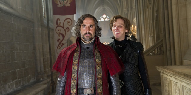 This film image released by Warner Bros. Pictures shows Stanley Tucci, left, and Ewen Bremner in a scene from "Jack the Giant Slayer."