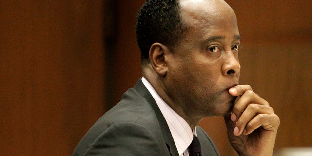 FILE - In this Friday, Oct. 21, 2011, file photo, Michael Jackson's former doctor Conrad Murray sits in a courtroom during his involuntary manslaughter trial in Los Angeles. Jurors hearing a civil case on Wednesday May 1,2013 against Jackson's concert promoter that Murray was more than $500,000 in debt and his finances were severely distressed. (AP Photo/Reed Saxon, Pool, File)