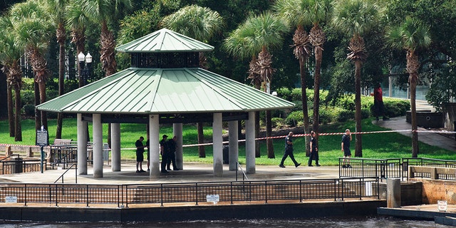 Police investigate the scene at Jacksonville Landing on Sunday, Aug, 26, after a mass shooting during a Madden Championship Series competition