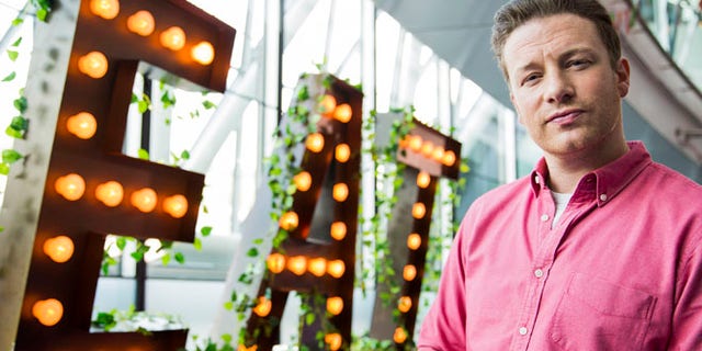 LONDON, ENGLAND - MAY 16: Jamie Oliver broadcasts a live cooking class from City Hall to school children across the globe as part of the third annual Food Revolution Day on May 16, 2014 in London, England. (Photo by Tristan Fewings/Getty Images)