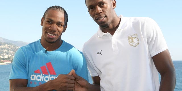 Nov. 12, 2011: This file photo shows Jamaican sprinters Usain Bolt, right, and Yohan Blake, posed at a news conference in Monaco.