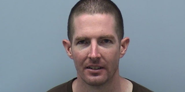 James Trainor was arrested Monday after allegedly throwing a brick at the glass door of Sen. Mark Warner's Virginia office. Police said they do not believe the vandalism was random.