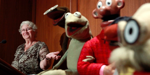 Aug. 25, 2010: In this photo, Jane Henson, left, donates some of Jim Henson's early puppets, including the original Kermit, to the Smithsonian Institution, during a ceremony at the National Museum of American History, in Washington.