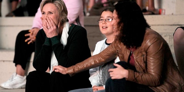 Jane Lynch with wife Dr. Lara Embry and Chase, one of her two step-daughters.