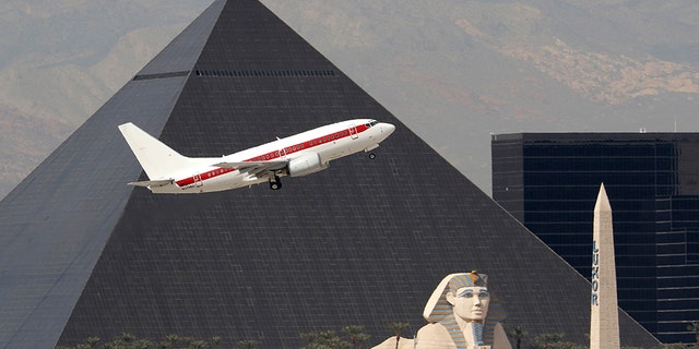 Inconspicuous: Janet planes are painted white with a horizontal red band along the side, and reportedly transport military employees and contractors to restricted sites, including Area 51.