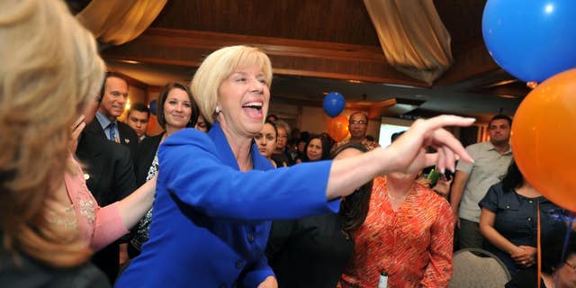 Los Angeles City councilwoman Janice Hahn, running for Congressional District 36th, makes her way through the crowd of supporters Tuesday night July 12, 2011 at her election party. (AP Photo/Sean Hiller - Daily Breeze)