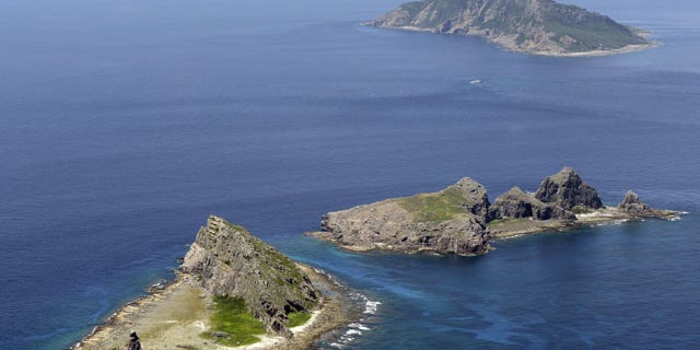 In this Sept. 2012 photo, the tiny islands in the East China Sea, called Senkaku in Japanese and Diaoyu in Chinese are seen. (AP Photo/Kyodo News)