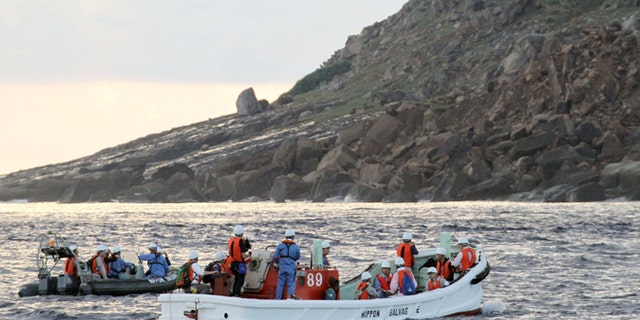 Sept. 2, 2012: Tokyo city officials and experts survey Uotsuri Island, one of the islands of Senkaku in Japanese and Diaoyu in Chinese, in the East China Sea.