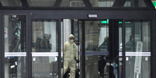 March 15: Officials wearing clothing to protect against radiation work in a center to scan residents who have been within 20 kilometers of the Fukushima Dai-ichi nuclear plant damaged by the March 11 earthquake.A U.S. nuclear industry official says there is evidence that the primary containment structure at one of the stricken Japanese reactors has been breached, raising the risk of further release of radioactive material.