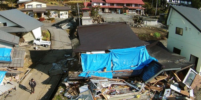 November 24, 2014: This aerial photo shows collapsed houses after a strong earthquake hit Hakuba, Nagano prefecture, central Japan. (AP Photo/Kyodo News)