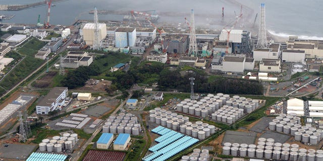 FILE - This Aug. 20, 2013 aerial file photo shows the Fukushima Dai-ichi nuclear plant at Okuma in Fukushima prefecture, northern Japan. Japan's nuclear regulator has upgraded the rating of a leak of radiation-contaminated water at its tsunami-wrecked nuclear plant to a "serious incident" on an international scale. (AP Photo/Kyodo News, File)