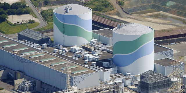 Aug. 11, 2015: This aerial photo shows reactors of No. 1, right, and No. 2, left, at the Sendai Nuclear Power Station in Satsumasendai, Kagoshima prefecture, southern Japan. (Kyodo News via AP)
