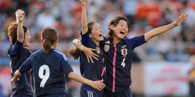 July 11, 2012: In this file photo, Japan's Homare Sawa, second right, celebrates after scoring their side's goal with teammates, Saki Kumagai (4), Nahomi Kawasumi (9), and Yuki Ogimi, left, against Australia during their friendly women's soccer match in Tokyo.