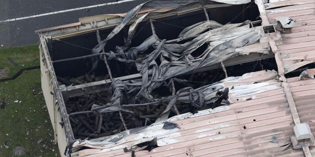 Aug. 24, 2015: U.S. Army Sagami Depot in Sagamihara, southwest of Tokyo is damaged after multiple explosions and a large fire. (Kyodo News via AP)
