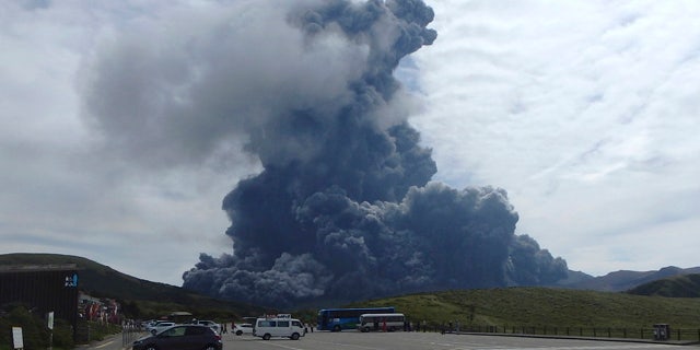 Sept. 14, 2015: In this photo released by Aso Volcano Museum, a column of black smoke rises from Mount Aso on the southern Japanese island of Kyushu. (Aso Volcano Museum via AP)