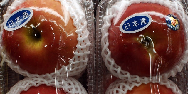 Apples with "Produced in Japan" stickers are seen at a Japanese supermarket in Hong Kong March 21, 2011. The World Health Organization said on Monday that the detection of radiation in food after an earthquake damaged a Japanese nuclear plant was a more serious problem than it had first expected. The Hong Kong Government on Monday has given assurances that the territory's food and water supplies have not been contaminated with radiation from Japan, according to local media.