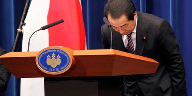 August 26: Japanese Prime Minister Naoto Kan bows during a press conference at his official residence in Tokyo, Japan.