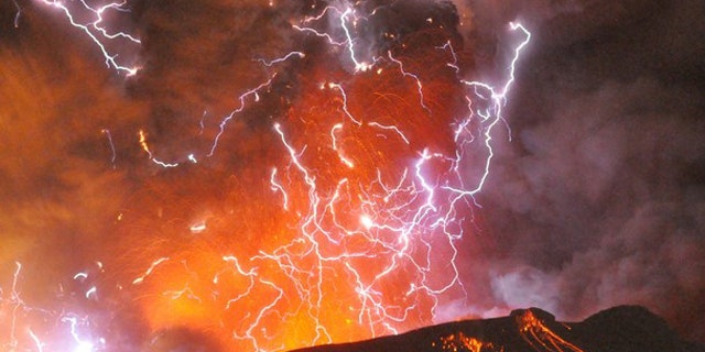 Jan. 28: Volcanic lightning or a dirty thunderstorm is seen above Shinmoedake peak as it erupts, between Miyazaki and Kagoshima prefectures, in this photo taken from Kirishima city and released by Minami-Nippon Shimbun.