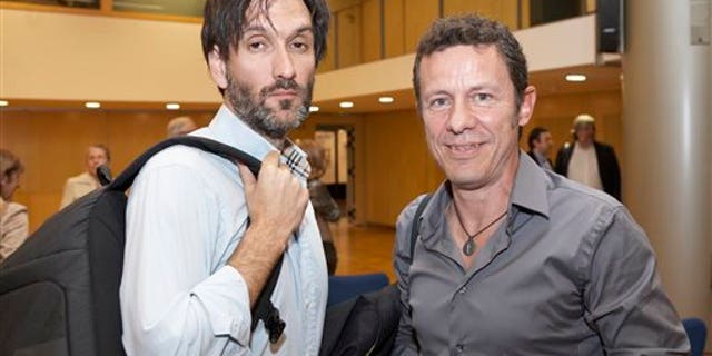 FILE - In this file photo taken on May 24, 2012, Spanish reporters Javier Espinosa, right, and Ricardo Garcia Vilanova, left, pose for a photo during the ceremony of the Miguel Gil journalisms awards in Barcelona, Spain. The two Spanish journalists were freed after being held captive for six months in Syria by a rogue al-Qaida group, the newspaper for which one of the men worked said Sunday March 30, 2014. Espinosa and Vilanova were held since September by the breakaway group, the Islamic State in Iraq and the Levant, who detained them at a checkpoint in the town of Tal Abyad in the eastern province of Raqqa, where the militants dominate. The two were trying to leave Syria at the time. (AP Photo/Joan Borras, file)