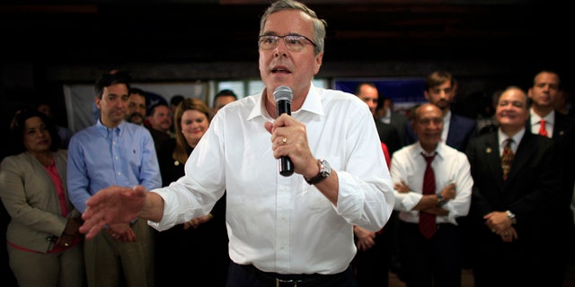 FILE - In this April 28, 2015 file photo, former Florida Gov. Jeb Bush speaks during a town hall meeting with Puerto Rico's Republican Party in Bayamon, Puerto Rico. Bush on Wednesday declared that 11 million immigrants in the country illegally should have an opportunity to stay, wading into the explosive immigration debate for the second time in two days while courting Hispanic voters. (AP Photo/Ricardo Arduengo, File)