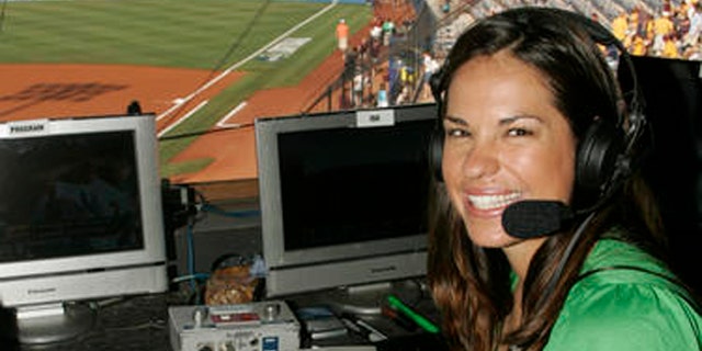 FILE - In this May 29, 2009 file photo, USA softball player Jessica Mendoza poses for a photo in the ESPN broadcast booth at the Women's College World Series in Oklahoma City. Mendoza chatted up Kyle Schwarber, broke down pitcher's tendencies and dealt with social media criticism in her historic first full season covering baseball for ESPN. Mendoza recently shuttled between Cleveland and Chicago, giving World Series updates eight times a day for "Baseball Tonight" and "Sports Center."(AP Photo)