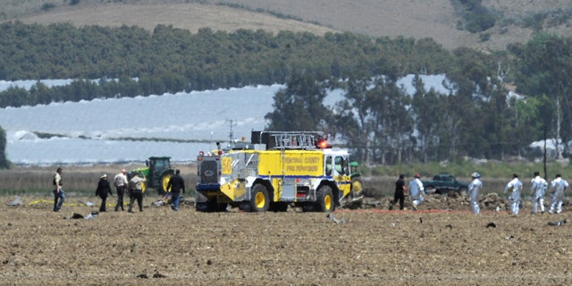 May 18, 2012: Ventura County firefighters and other emergency response personnel work amidst the wreckage of a Hawker Hunter, a single-seat fighter/ground attack monoplane, that crashed about 12:15 p.m. in a field off Broome Ranch Road between CSU Channel Islands in Camarillo and Point Mugu, Calif.