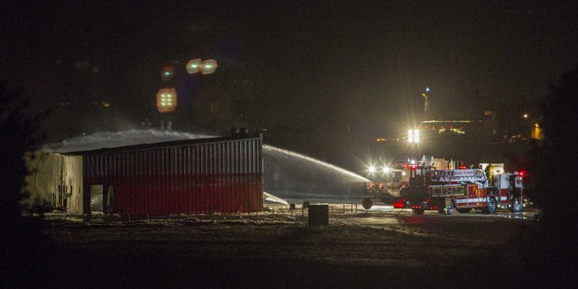 September 29, 2013: Firefighters work to extinguish fire at the site of a plane crash in Santa Monica, Calif. (AP Photo)