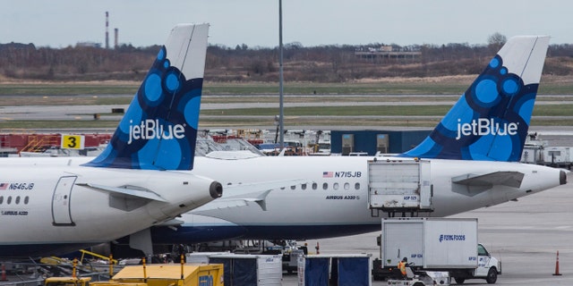 NEW YORK, NY - APRIL 23: JetBlue planes sit at their gates at John F. Kennedy Airport on April 23, 2014 in the Queens borough of New York City. JetBlue pilots voted to unionize today by a 71% margin. (Photo by Andrew Burton/Getty Images)