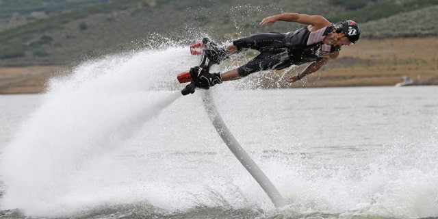 July 24, 2013: Rocky Mountain Flyboard instructor Chase Shaw demonstrates his flyboard, on the Jordanelle Reservoir, at Jordanelle State Park, Utah.
