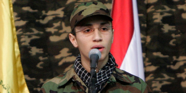 Feb. 22, 2008: Jihad Mughniyeh, the son of slain top Hezbollah commander Imad Mughniyeh, speaks during a rally to commemorate his father and two other leaders Abbas Musawi and Ragheb Harb, in the Shiite suburb of Beirut, Lebanon. A Hezbollah official said Sunday, Jan. 18, 2015, that an Israeli strike in the Syrian Golan Heights killed Jihad Mughniyeh and four other fighters from the Lebanese Shiite militant group.