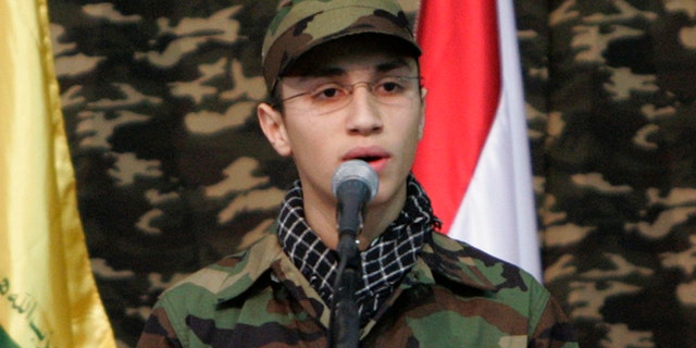 Feb. 22, 2008: Jihad Mughniyeh, the son of slain top Hezbollah commander Imad Mughniyeh, speaks during a rally to commemorate his father and two other leaders Abbas Musawi and Ragheb Harb, in the Shiite suburb of Beirut, Lebanon. A Hezbollah official said Sunday, Jan. 18, 2015, that an Israeli strike in the Syrian Golan Heights killed Jihad Mughniyeh and four other fighters from the Lebanese Shiite militant group.