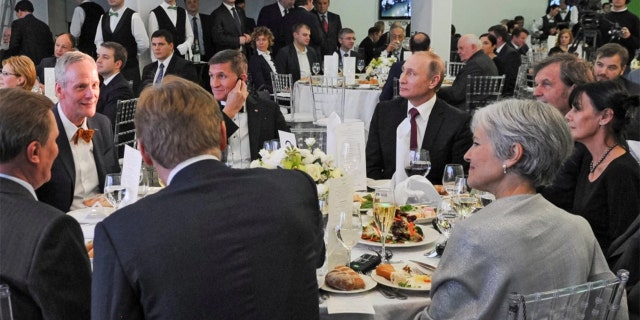 Russian President Vladimir Putin, center right, with retired U.S. Lt. Gen. Michael T. Flynn, center left, and former Green Party presidential candidate Jill Stein, front right, attend a 2015 dinner in Moscow.