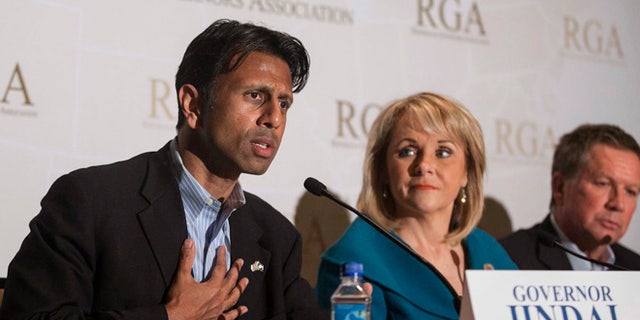 FILE 2013: Governor Bobby Jindal answers a question during a media briefing at the Republican Governors Association conference in Scottsdale, Arizona.