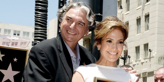 Jennifer Lopez, with director Gregory Nava, honored on the Hollywood Walk of Fame on June 20, 2013 in Los Angeles.