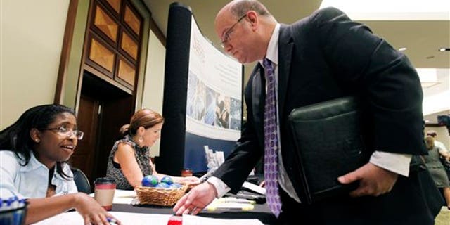 August 4: Job seeker during a Career Job Fair in Arlington, Va.