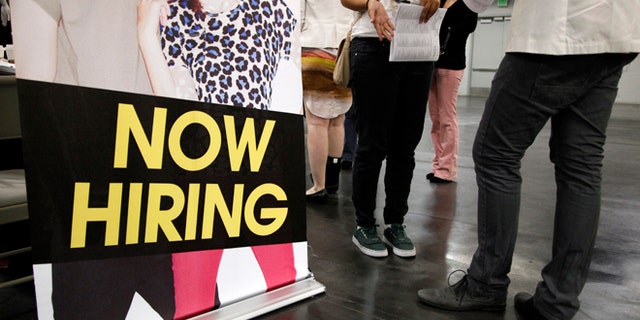 June 13, 2012: A job seeker talks to a recruiter at a job fair expo in Anaheim, Calif.