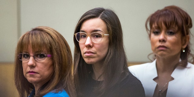 FILE - Convicted murderer Jodi Arias, center, watches the jury enter the courtroom before hearing their verdict in this March 5, 2015 file photo taken in Maricopa County Superior Court in Phoenix. A court document released Tuesday March 10, 2015 by the judge in the case reveals the behind-the-scenes wrangling in the jury room as Arias' fate hung in the balance. (AP Photo/The Arizona Republic, Tom Tingle, Pool, File)