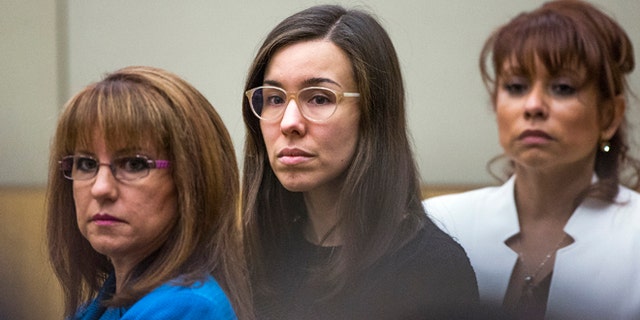 FILE - Convicted murderer Jodi Arias, center, watches the jury enter the courtroom before hearing their verdict in this March 5, 2015 file photo taken in Maricopa County Superior Court in Phoenix. A court document released Tuesday March 10, 2015 by the judge in the case reveals the behind-the-scenes wrangling in the jury room as Arias' fate hung in the balance. (AP Photo/The Arizona Republic, Tom Tingle, Pool, File)