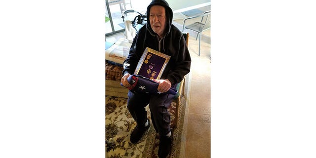 Dr. Joe Guiliani with the missing Purple Heart.